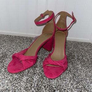 Pink open toe block heels.